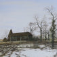 Paul Evans - Oast house in winter landscape