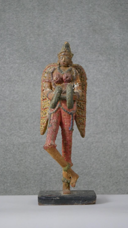 South American winged figure on base