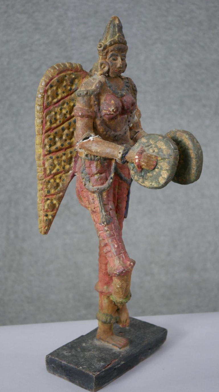 South American winged figure on base