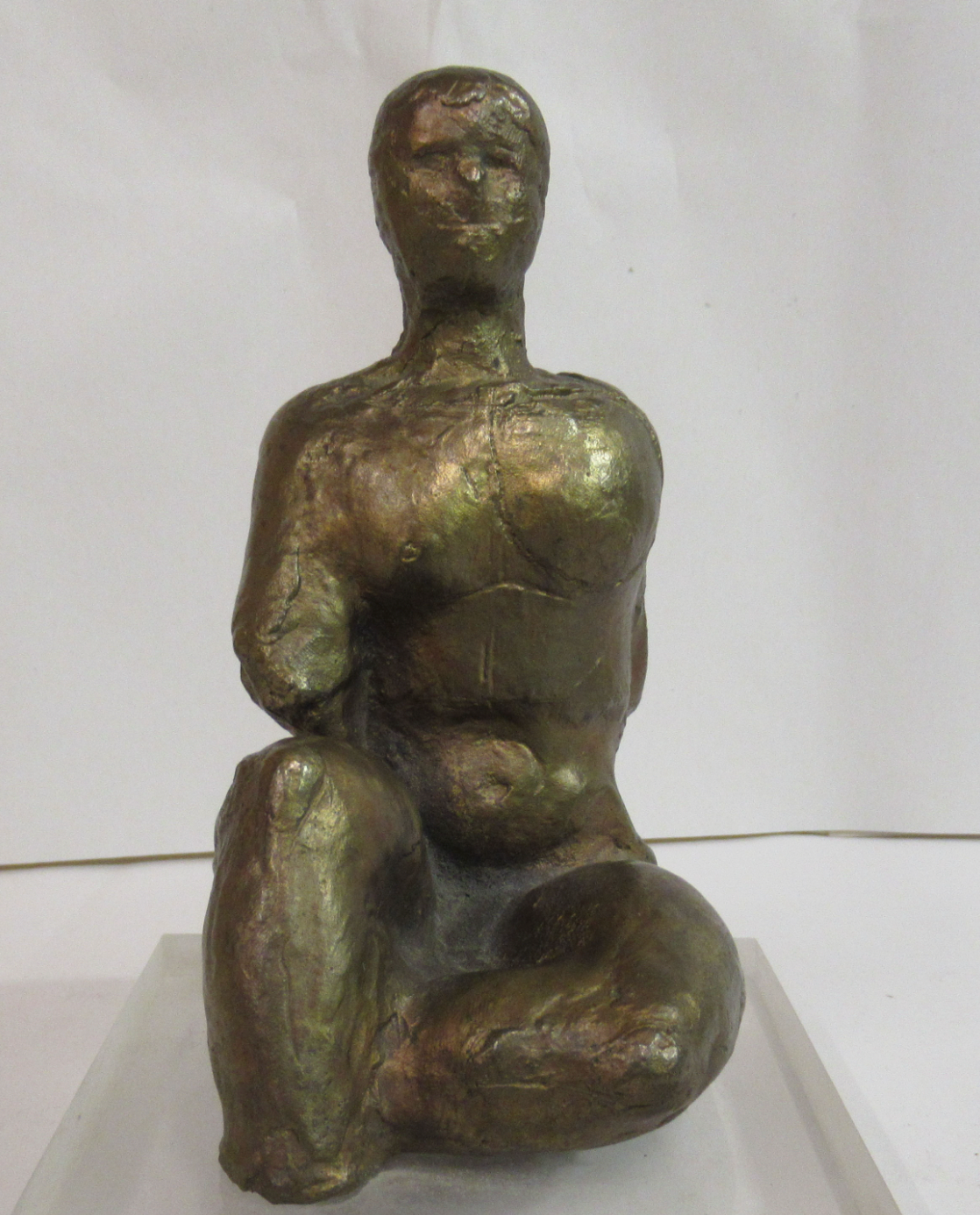 Seated woman on a perspex plinth