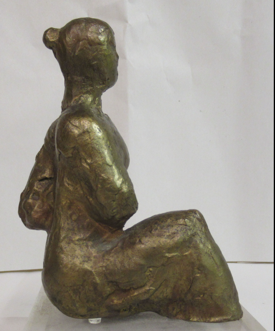 Seated woman on a perspex plinth